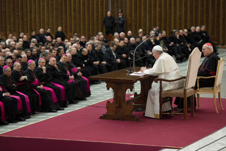 Prelates and priests look on as Pope Francis leads a meeting with priests in Paul VI audience hall at the Vatican March 6. (CNS/L'Osservatore Romano)