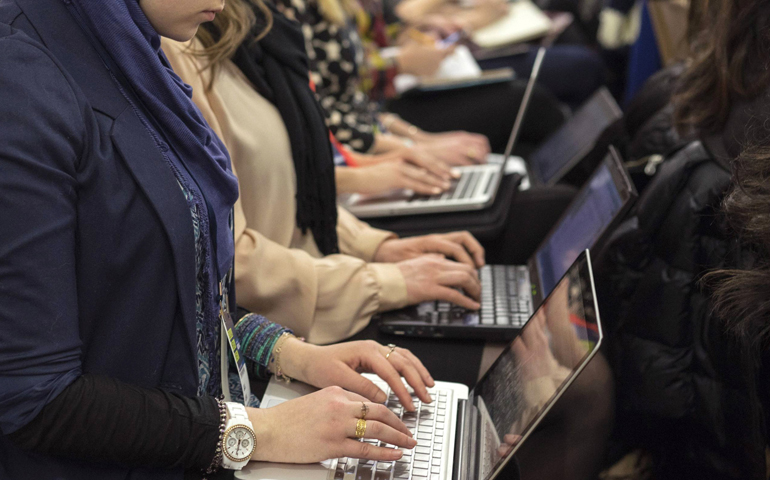 Attendees use their computers during a seminar at Social Media Week in New York, in this 2014 photo (CNS/Zoran Milich, Reuters)