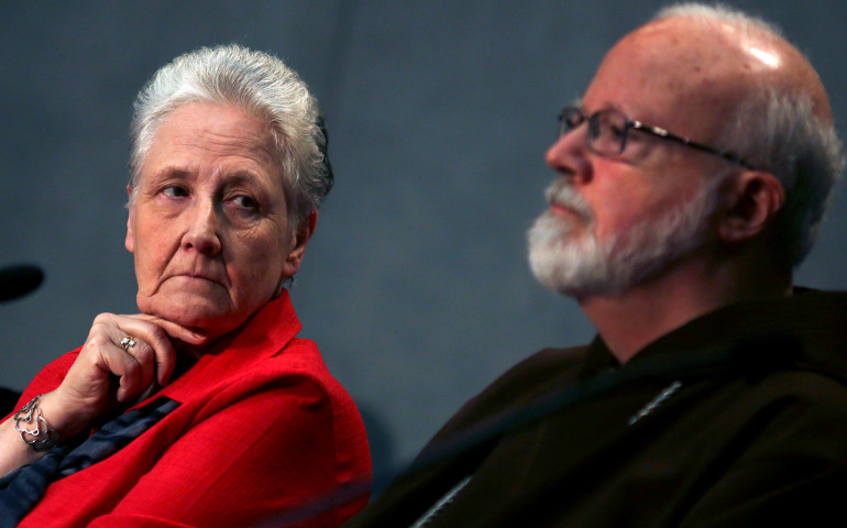 Irish abuse victim Marie Collins looks at Boston Cardinal Sean O'Malley during the first briefing of the Pontifical Commission for the Protection of Minors at the Vatican May 3, 2016. (CNS/Reuters/Alessandro Bianchi)