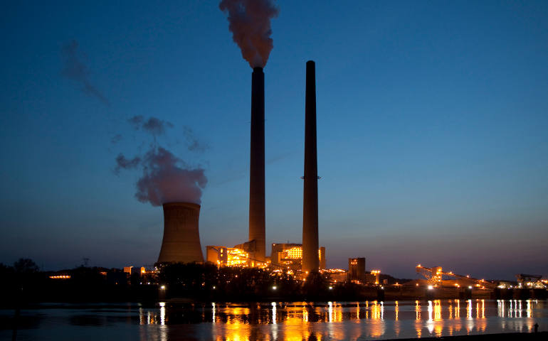 Smoke rises from the coal-fired Mountaineer Power Plant, in New Haven, W.Va., in this file photo. The U.S. Environmental Agency released Aug. 4 its Clean Power Plan, which seeks to reduce carbon emissions from coal- and gas-fired power plants by 32 percent by 2030. (CNS photo/Jim West)