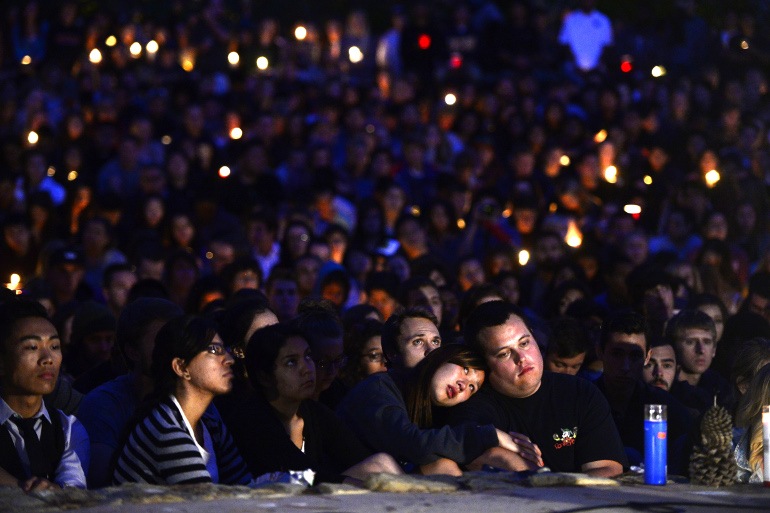 People gather at a park May 24 for a candlelight vigil for the victims of a killing rampage in the town of Isla Vista, Calif., a neighboring community of the University of California at Santa Barbara. (CNS/EPA/Michael Nelson)