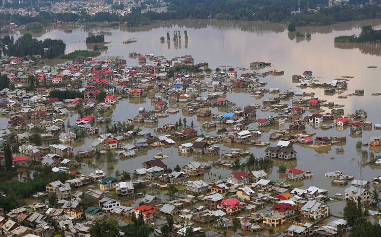 This aerial view taken Sept. 10 shows houses submerged by floodwater in Srinagar, India, located in the Kashmir Valley in the foothills of the Himalayas. (CNS photo/EPA)
