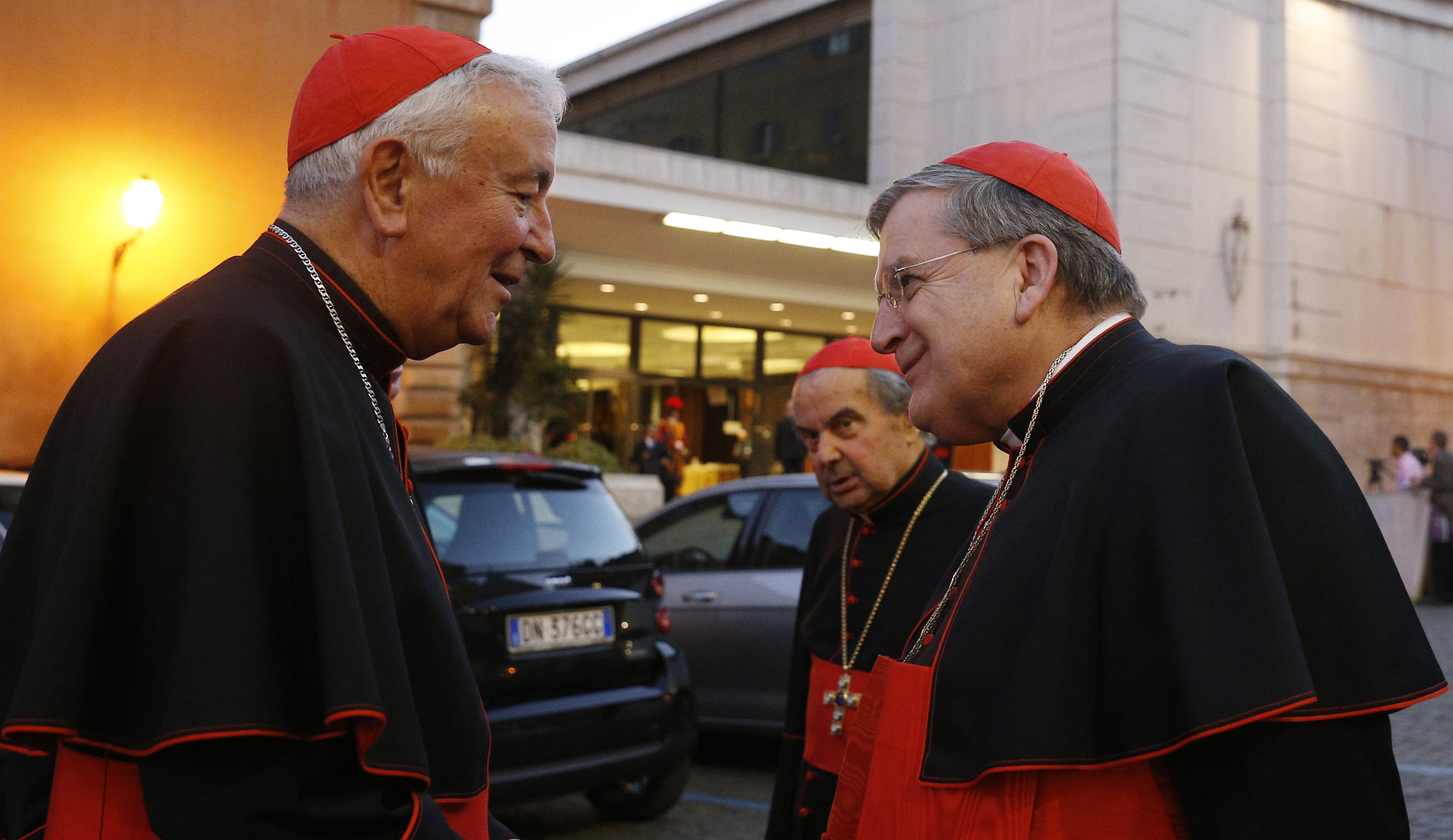 Cardinal Vincent Nichols, left, Cardinal Carlo Caffarra, center, and Cardinal Raymond Burke, in a 2014 file photo. Burke and Caffarra were two of four cardinals that publicly questioned Pope Francis' teachings on family life in a letter published Nov. 14. (CNS/Paul Haring)