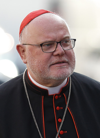 Cardinal Reinhard Marx of Munich and Freising, Germany, coordinator of the Vatican's Secretariat for the Economy, arrives for the opening session of the extraordinary Synod of Bishops on the family at the Vatican in this Oct. 6, 2014 file photo. (CNS/Paul Haring)