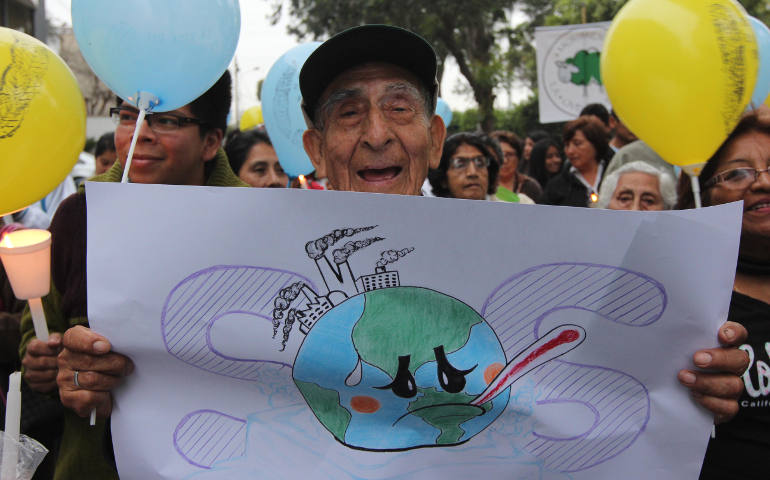 Valerio Mendoza, 83, joins a Nov. 30 vigil for climate change on the eve of the U.N. climate summit in Lima, Peru. (CNS photo/Barbara Fraser)