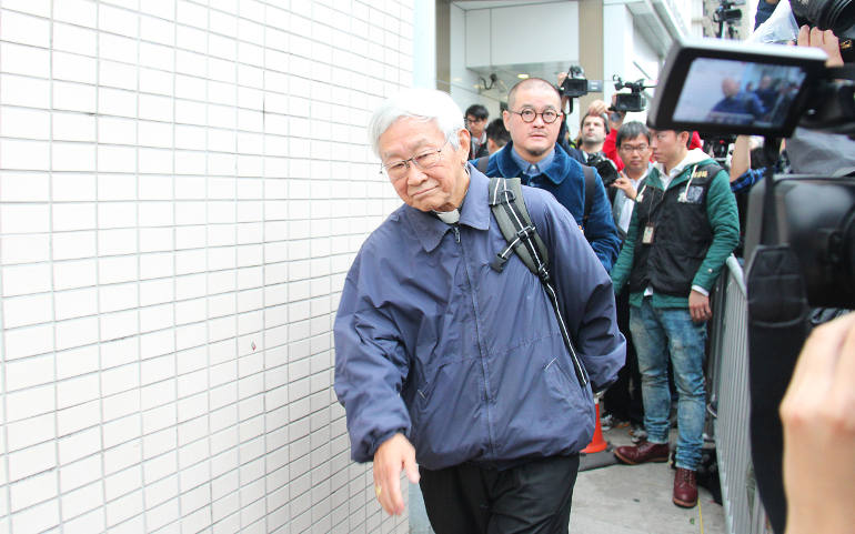 Cardinal Joseph Zen Ze-kiun, retired bishop of Hong Kong, leaves the police station after surrendering to police Dec. 3. Zen stayed at the police station for an hour, documenting his involvement in the Occupy Central movement. (CNS photo/Francis Wong)