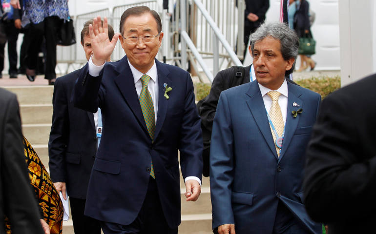 Peruvian Environment Minister Manuel Pulgar-Vidal, right, walks next to U.N. Secretary-General Ban Ki-moon. as they arrive for the opening of the U.N. Climate Change Conference in Lima, Peru, Dec. 9. In a message to Pulgar-Vidal, Pope Francis said the time to so lve the problem of climate change "is running out." He also insisted climate change is a serious moral problem. (CNS photo/Enrique Castro-Mendivil, Reuters)