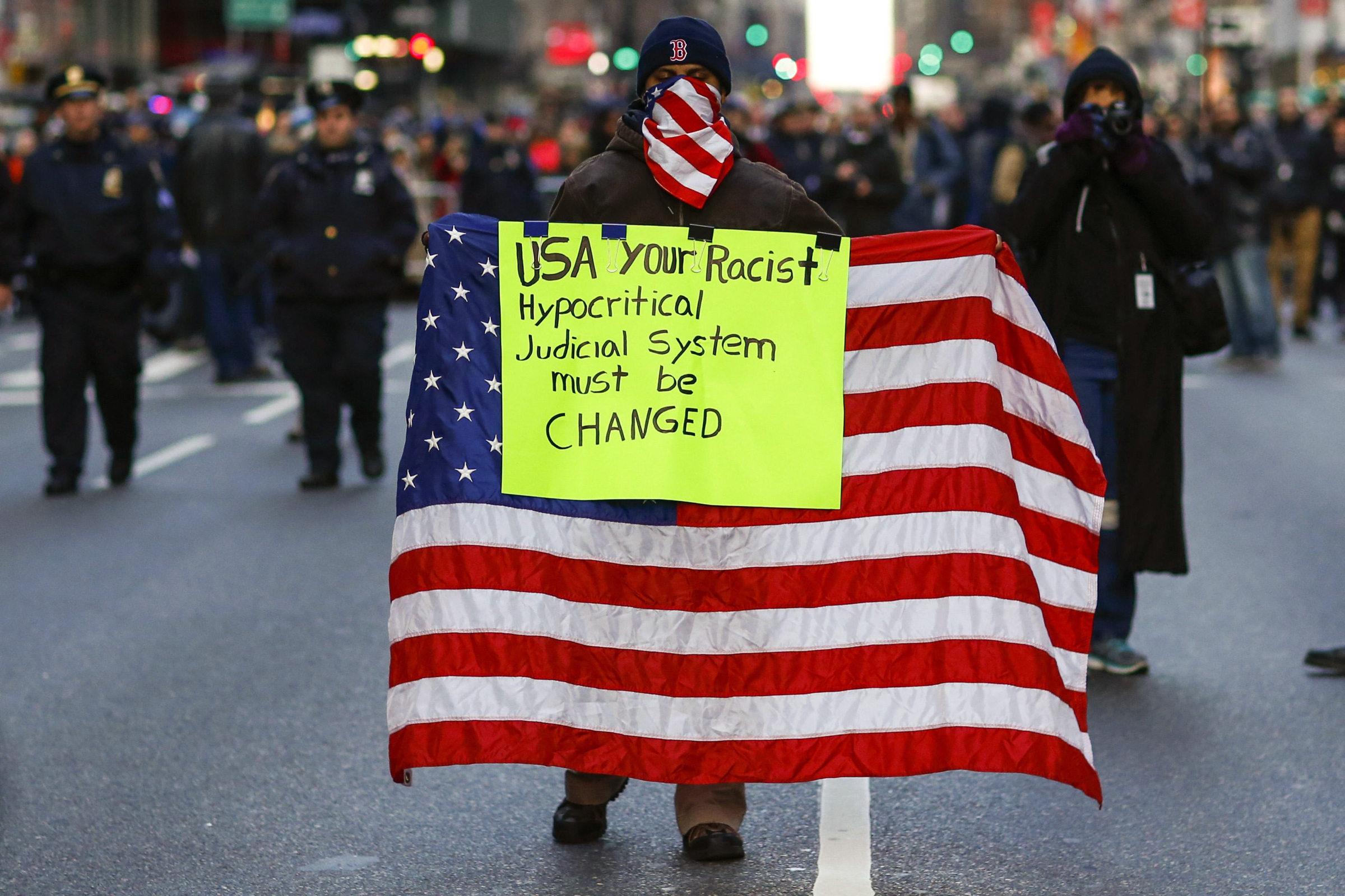 A man takes part in a march in New York Dec. 13, 2014, calling for changes in the criminal justice system. (CNS/Reuters/Eduardo Munoz)