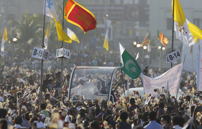 Pope Francis arrives in the popemobile before he celebrates the canonization Mass of St. Joseph Vaz at Galle Face Green in Colombo, Sri Lanka, Jan. 14. (CNS photo/Paul Haring)