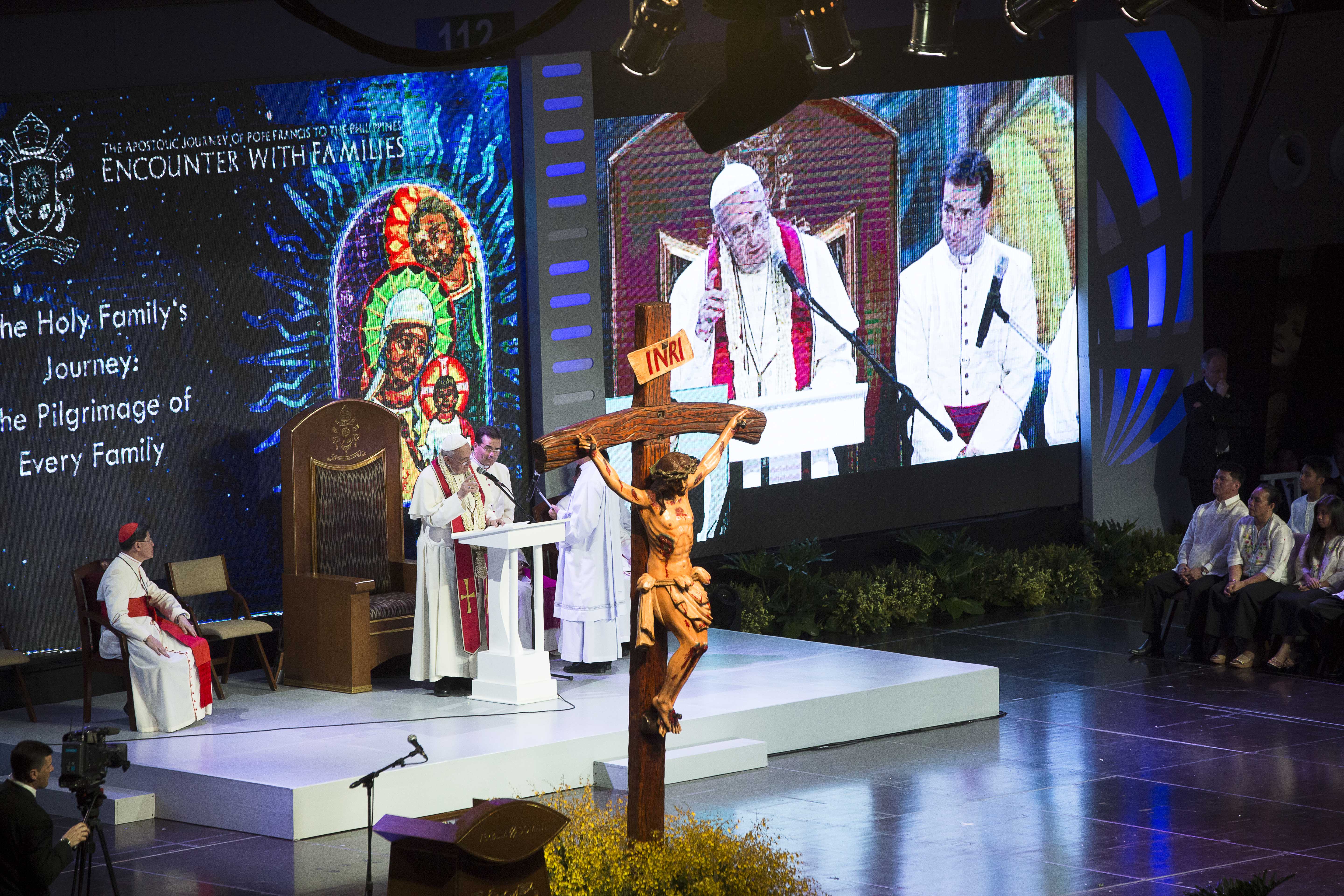 Pope Francis and Cardinal Luis Antonio Tagle of Manila, Philippines, are seen on a big screen during a meeting with families at the Mall of Asia Arena in Pasay City, Philippines, Jan. 16. (CNS/Tyler Orsburn)