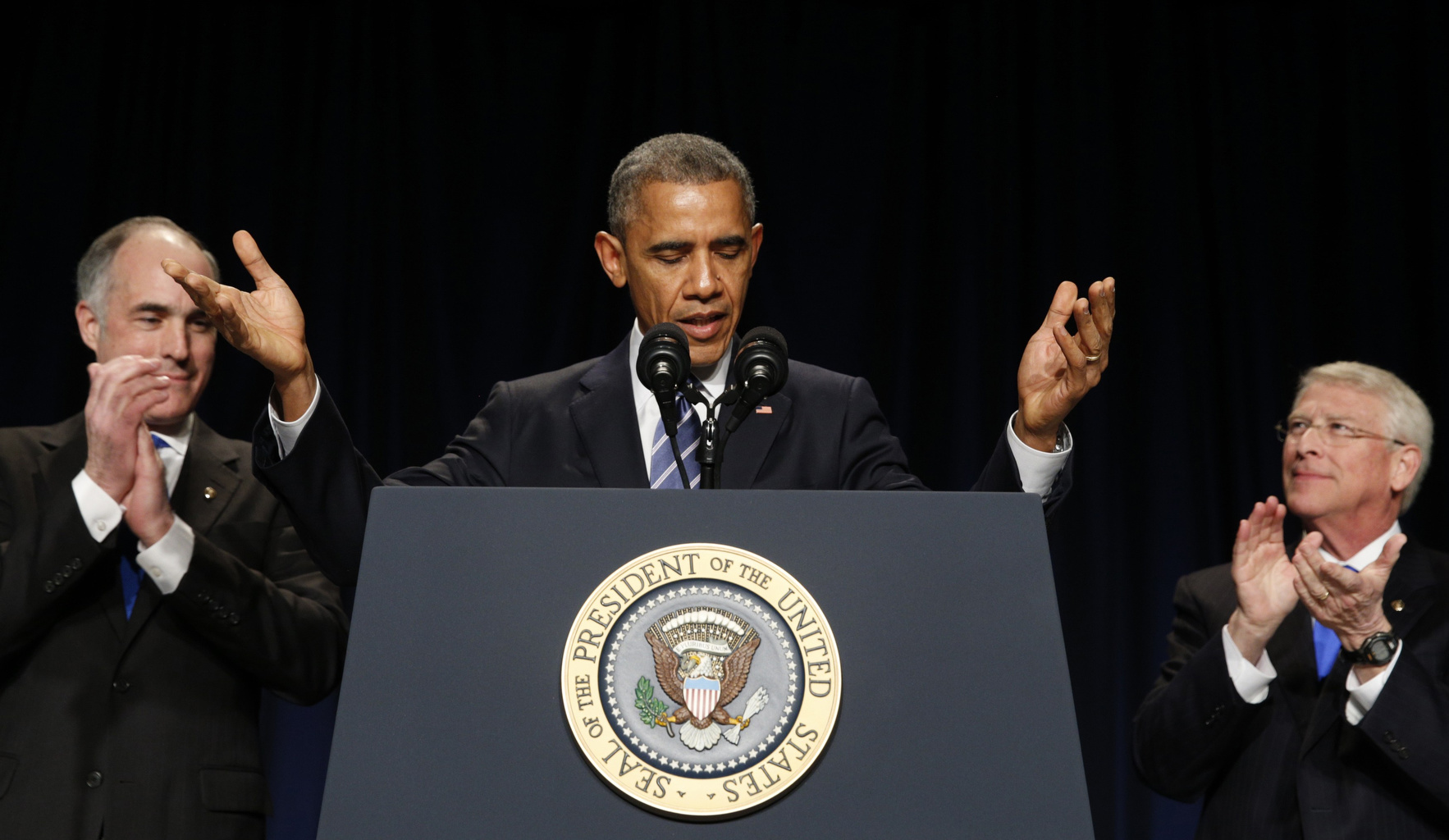 U.S. Sen. Robert Casey, D-Pa., and Sen. Roger Wicker, R-Miss., applaud as President Barack Obama takes the stage to speak at the National Prayer Breakfast in Washington Feb. 5. (CNS/Reuters/Kevin Lamarque)