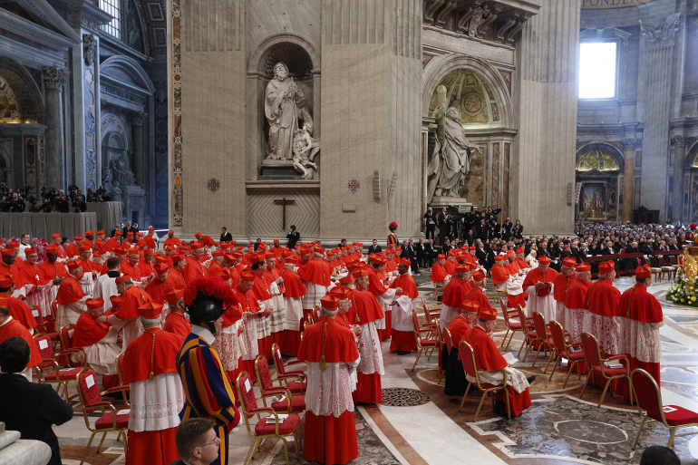 New cardinals exchange greetings with fellow cardinals during a consistory at which Pope Francis created 20 new cardinals in St. Peter's Basilica at the Vatican Feb. 14. (CNS photo/Paul Haring)