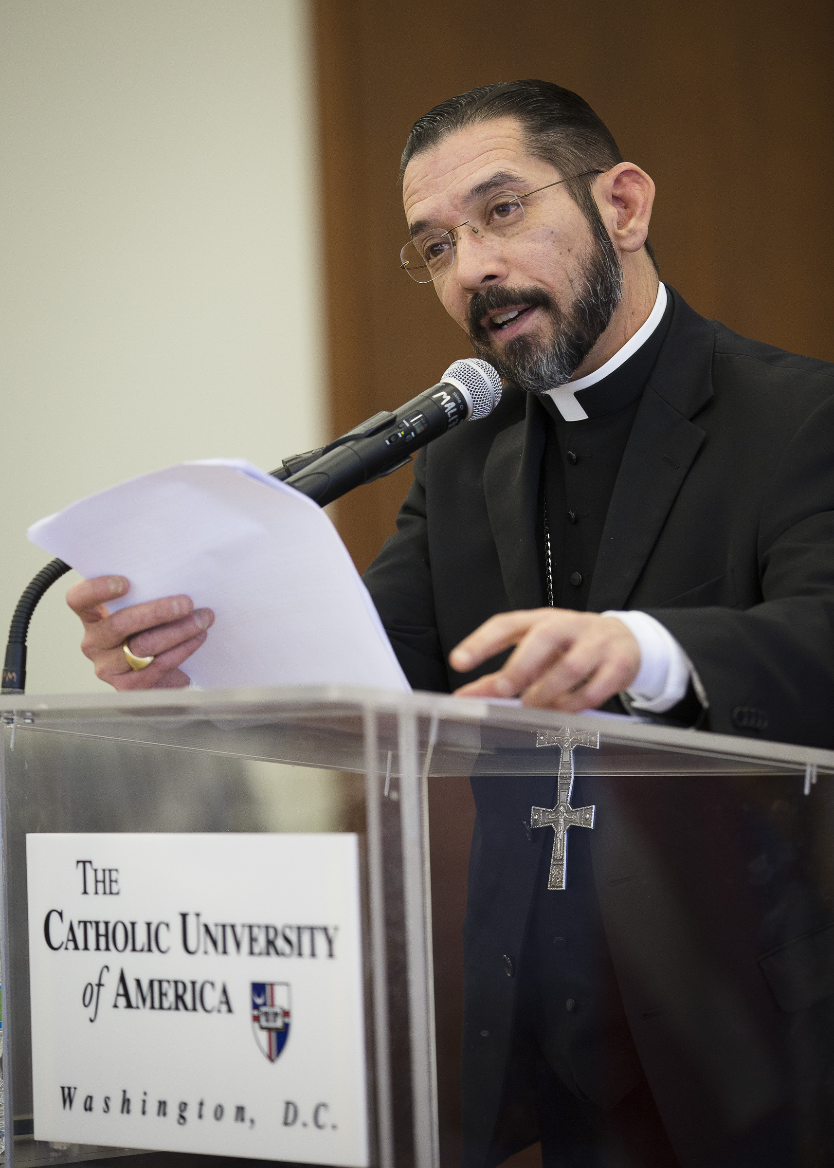 Bishop Daniel Flores of Brownsville, Texas, delivers a lecture on immigration Feb. 24 on the campus of The Catholic University of America in Washington, urging the country to breakout of social "paralysis" on the issue and approach it with faith. (CNS/Tyler Orsburn) 