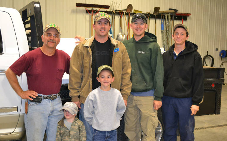 Tony Horinek poses in 2014 at his farm in Colby, Kan., with his sons, Clint and Aaron, and full-time employee Martin Lager, right. In front are Aaron's sons Simeon and Edward. (CNS photo/Photos courtesy of the Horinek family)