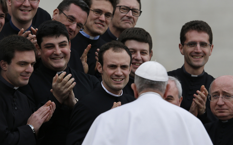 Pope Francis greets clergy during his general audience in St. Peter's Square at the Vatican March 4, 2015. (CNS/Paul Haring)