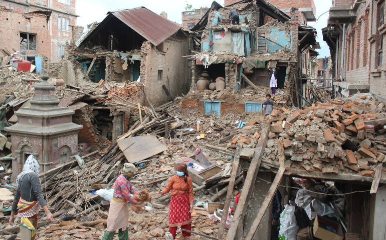 Earthquake survivors of Harsiddhi village on the outskirts of Kathmandu, Nepal, retrieve belongings from their destroyed homes April 29, five days after a major earthquake struck the region. (CNS photo/Anto Akkara)
