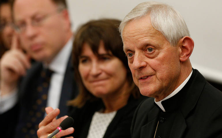 Cardinal Donald W. Wuerl of Washington speaks at a conference on climate change at the Pontifical University of the Holy Cross in Rome May 20. (CNS photo/Paul Haring)