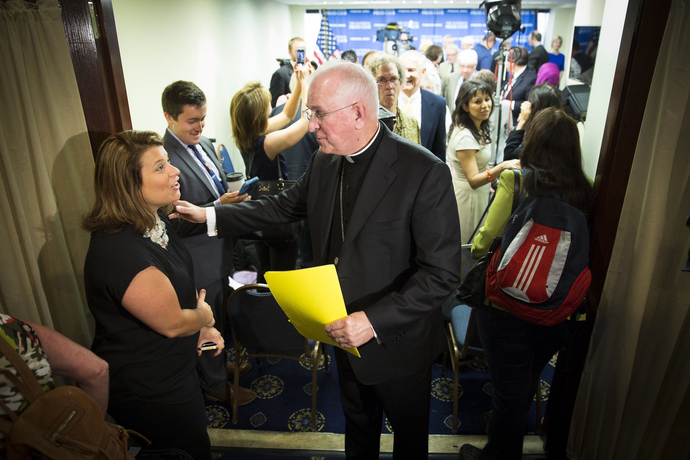 Archbishop Joseph Kurtz of Louisville, Ky., president of the U.S. Conference of Catholic Bishops, departs the National Press Club in Washington June 18 after a news conference on Pope Francis' environmental encyclical. (CNS/Tyler Orsburn) 