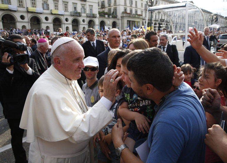 Pope Francis greets family members as he leaves a gathering with young people in Piazza Vittorio in Turin, Italy, June 21. (CNS photo/Paul Haring)