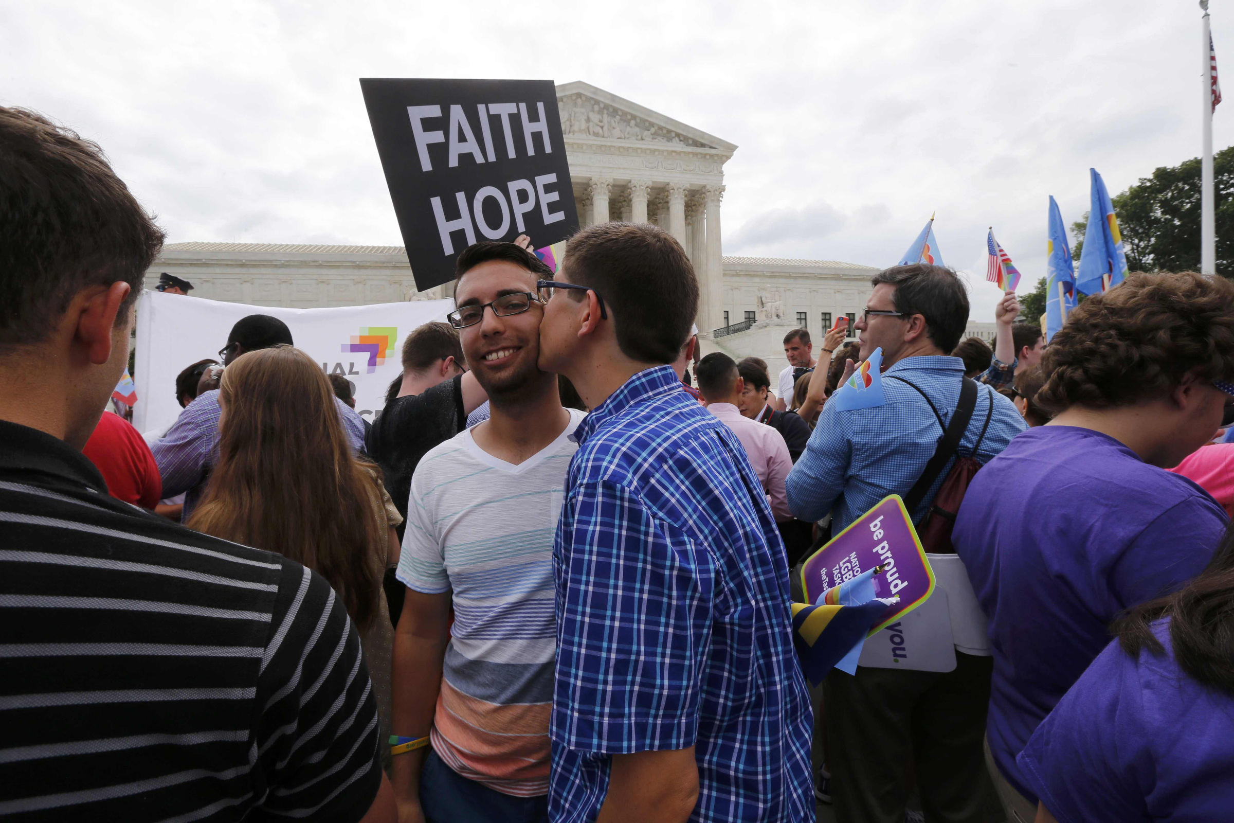 Gay rights supporters celebrate outside the U.S. Supreme Court building in Washington June 26 after the justices ruled in a 5-4 decision that the U.S. Constitution gives same-sex couples the right to marry. (CNS/Reuters/Jim Bourg) 