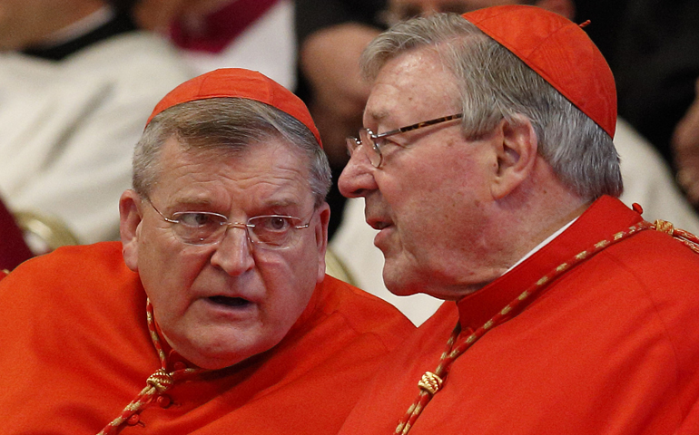 Cardinal Raymond Burke talks with Cardinal George Pell, before Pope Francis' celebration of Mass in St. Peter's Basilica at the Vatican June 29. (CNS/Paul Haring)
