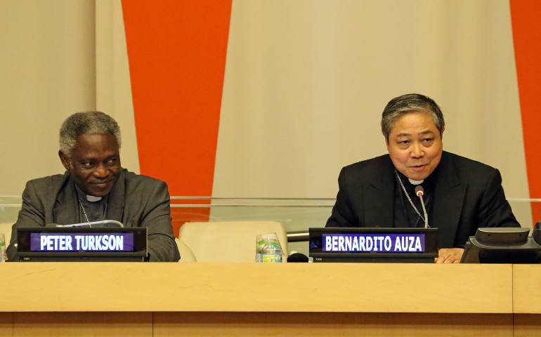 Ghanaian Cardinal Peter Turkson, president of the Pontifical Council for Justice and Peace, and Archbishop Bernardito Auza, Vatican nuncio to the United Nations, are seen during a presentation on Pope Francis' encyclical on the environment June 30 at U.N. headquarters in New York City. (CNS photo/Gregory A. Shemitz)