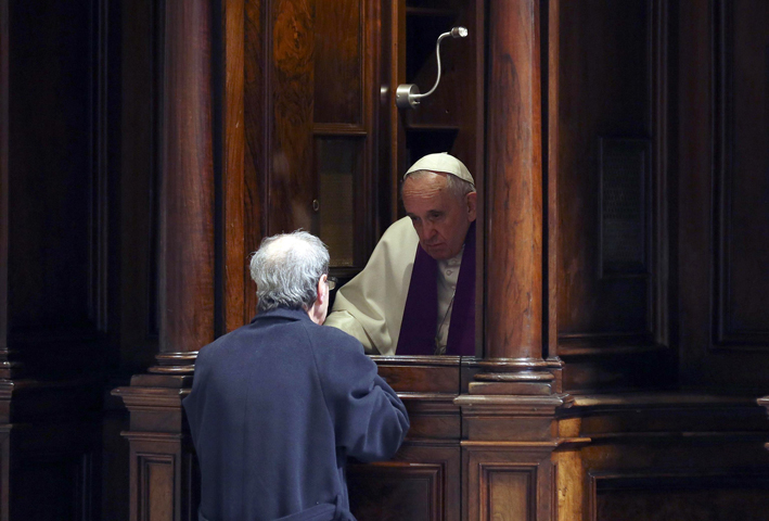 Pope Francis hears confession during a penitential liturgy in early March in St. Peter's Basilica at the Vatican. (CNS photo/Alessandro Bianchi pool via EPA)