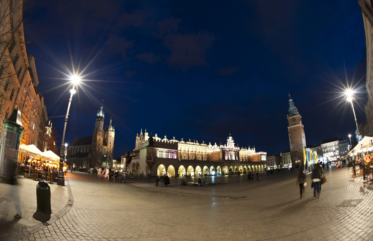 The main square and St. Mary's Basilica are seen in a 2012 nighttime view of Krakow, Poland. Auxiliary Bishop Damian Muskus of Krakow, who is overseeing preparations for World Youth Day 2016, has urged priests to ensure no young people are excluded. (CNS photo/Marcin Mazur)