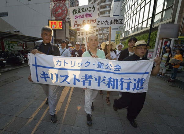 Christians from Japan and around the world joined together in an Aug. 5 march to the Catholic Memorial Cathedral for World Peace in Hiroshima, Japan, as part of the commemoration of the 70th anniversary of the U.S. dropping an atomic bomb on the Japanese city. (CNS photo/Paul Jeffrey)
