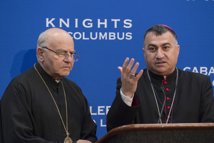 Chaldean Catholic Archbishop Bashar Warda of Irbil, Iraq, gestures alongside Melkite Archbishop Jean-Clement Jeanbart of Aleppo, Syria, during an Aug. 4 news conference at the Knights of Columbus 133rd Supreme Convention in Philadelphia. (CNS photo/Matthew Barrick, Knights of Columbus) 