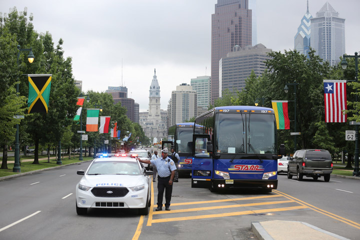 Members of the media gather near the Philadelphia Museum of Art along Benjamin Franklin Parkway in Philadelphia during a July 9 preview tour for Pope Francis' trip to the U.S. in September. (CNS photo/Bob Roller)