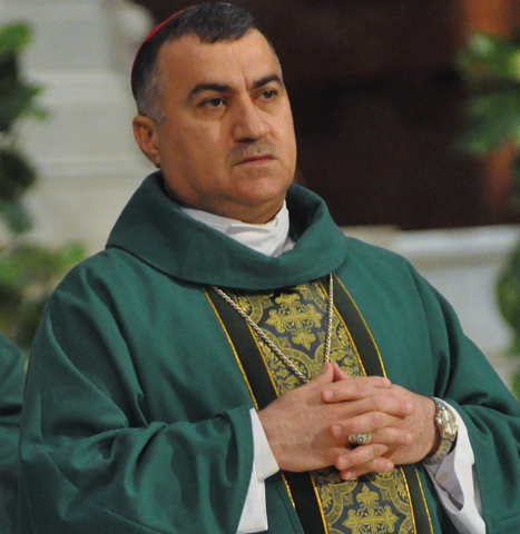 Chaldean Catholic Archbishop Bashar Warda of Irbil, Iraq, concelebrates an Aug. 23 Mass at SS. Peter and Paul Cathedral in Indianapolis. The archbishop visited several U.S. cities and discussed his experience with the flood of Christian refugees to Irbil following the Islamic State's capture of Mosul and the Ninevah Plain. (CNS/Sean Gallagher, The Criterion) 
