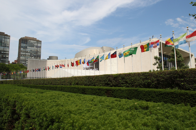 Flags of some of the 193 full member-countries of the United Nations are seen outside the U.N. General Assembly building in New York City June 30. (CNS/Gregory A. Shemitz)