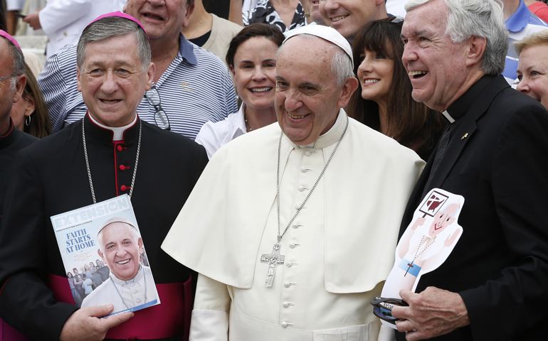 Archbishop Blase Cupich of Chicago, left, and Fr. Jack Wall, president of Catholic Extension, pose with Pope Francis in St. Peter's Square at the Vatican Sept. 2, 2015. (CNS/Paul Haring)