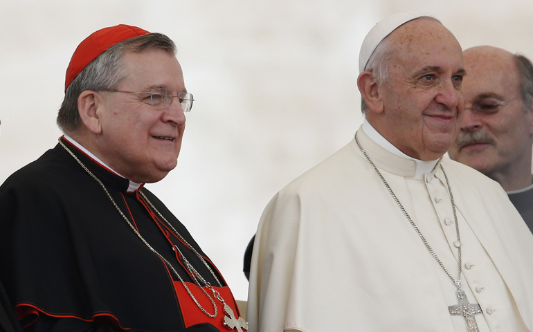 U.S. Cardinal Raymond L. Burke, patron of the Knights and Dames of Malta, poses with Pope Francis during his general audience in St. Peter's Square at the Vatican Sept. 2, 2015. (CNS/Paul Haring)