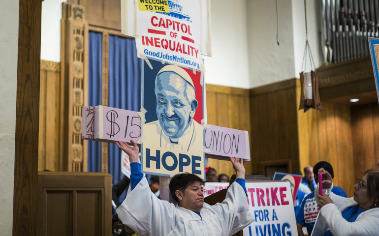 Contract workers from the U.S. Capitol and other federal buildings rally at the Lutheran Church of the Reformation during a strike over wages in Washington in September 2015. (CNS photo/Joshua Roberts) 