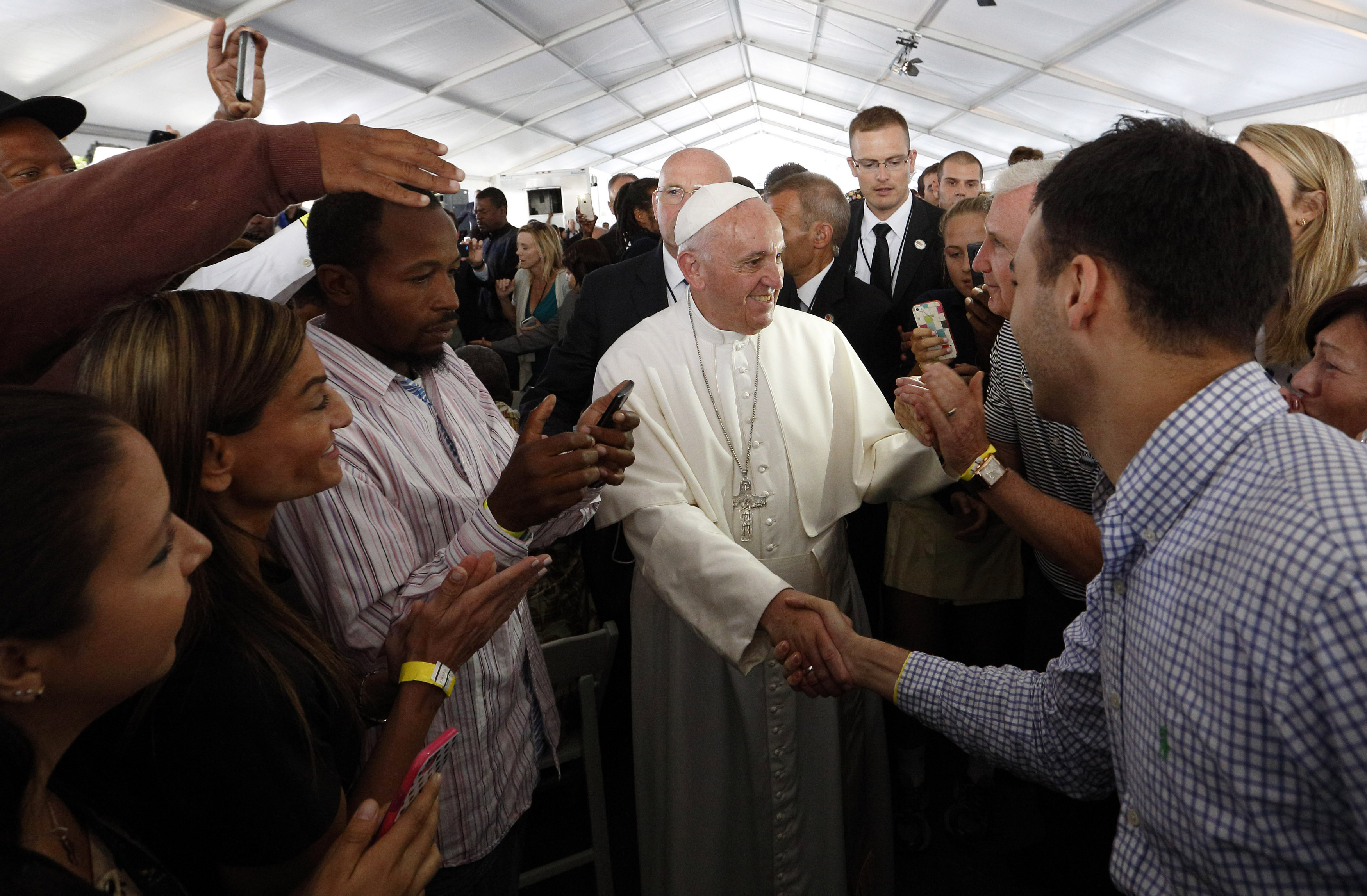 Pope Francis meets people involved with St. Maria's Meals Program of Catholic Charities in Washington Sept. 24. (CNS/Paul Haring)