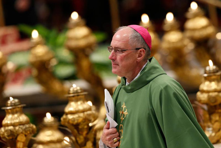 Canadian Archbishop Paul-Andre Durocher of Gatineau, Quebec, arrives for the opening Mass of the Synod of Bishops on the family celebrated by Pope Francis in St. Peter's Basilica at the Vatican Oct. 4. (CNS/Paul Haring)