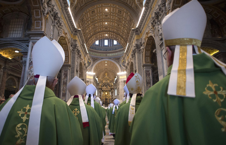 Bishops arrive in procession for the opening Mass of the Synod of Bishops on the family in St. Peter's Basilica at the Vatican Oct. 4. (CNS photo/L'Osservatore Romano, handout)