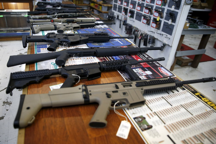 Guns for sale are displayed in Roseburg Gun Shop in Roseburg, Ore., Oct. 3. Archbishop Blase J. Cupich of Chicago, saying it is time to "take meaningful and swift action to address violence in our society," called for stricter gun control laws in Illinois and around the nation. (CNS/Lucy Nicholson, Reuters)