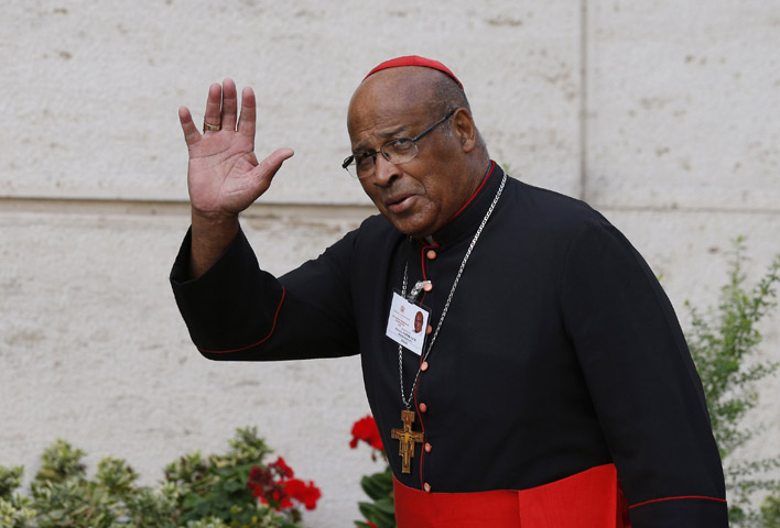 Cardinal Wilfrid F. Napier of Durban, South Africa, greets media as he arrives for a session of the Synod of Bishops on the family at the Vatican Oct. 16. (CNS/Paul Haring)