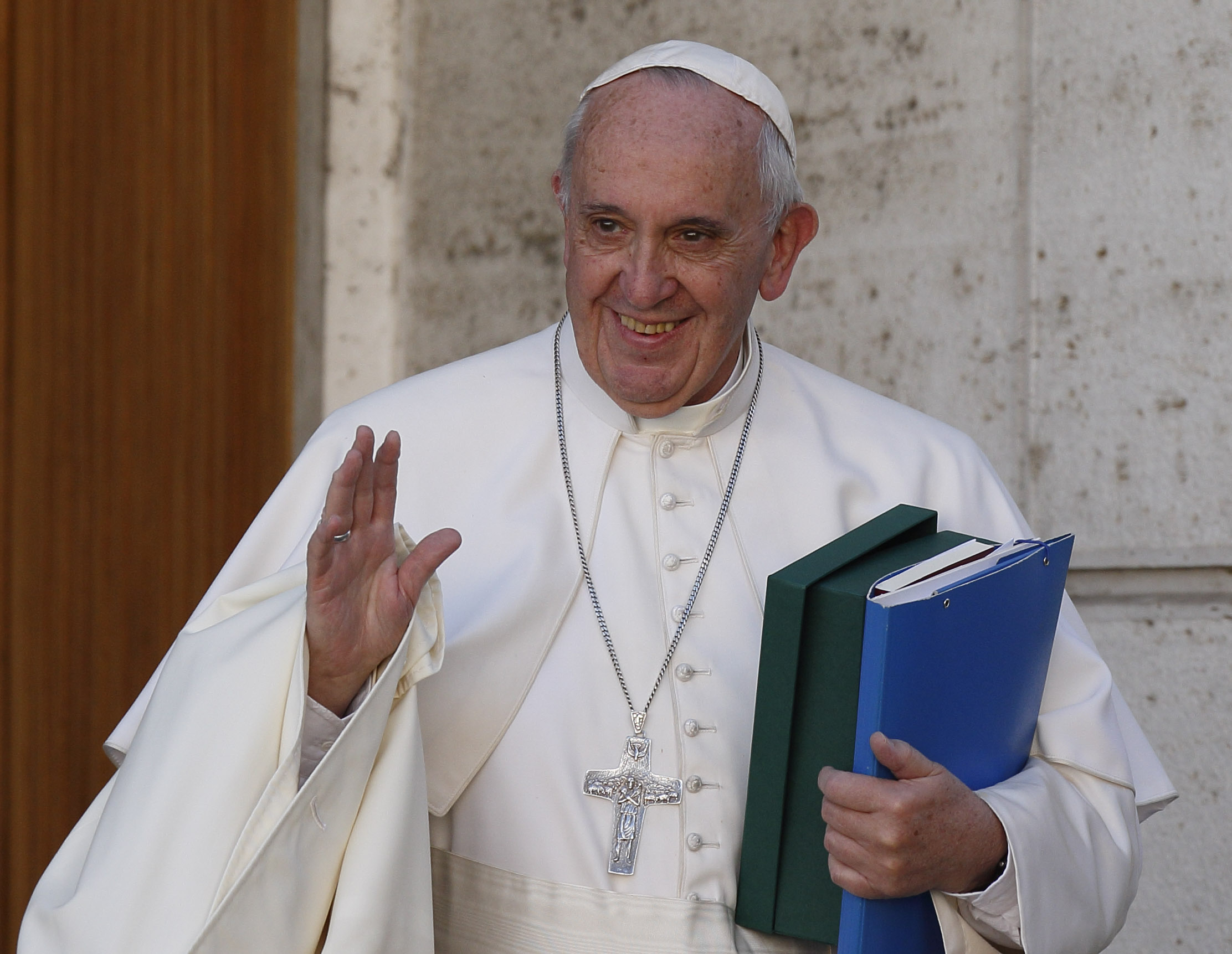 Pope Francis waves as he leaves a session of the Synod of Bishops on the family at the Vatican Oct. 24. (CNS/Paul Haring)