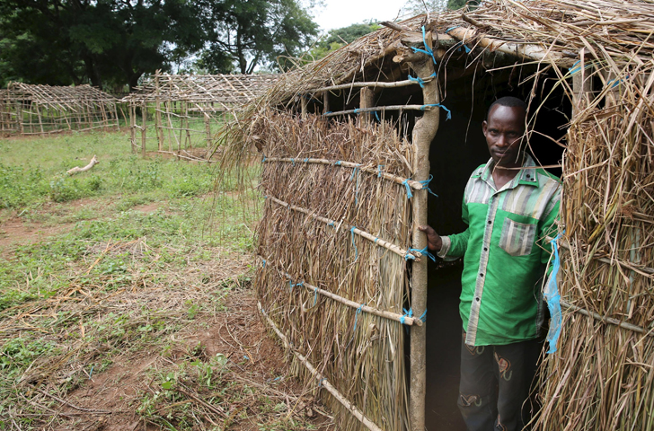 An internally displaced man stands in front of his makeshift house at a camp in Bambari, Central African Republic, Oct. 17. Despite ongoing violence in the African nation, Pope Francis said he hopes to be able to visit the country in late November and to anticipate the Year of Mercy by opening the Holy Door of the cathedral in Bangui, the nation's capital. (CNS/Goran Tomasevic, Reuters) 