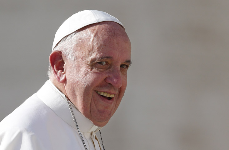 Pope Francis smiles as he leaves his general audience in St. Peter's Square at the Vatican Nov. 4. (CNS/Paul Haring)