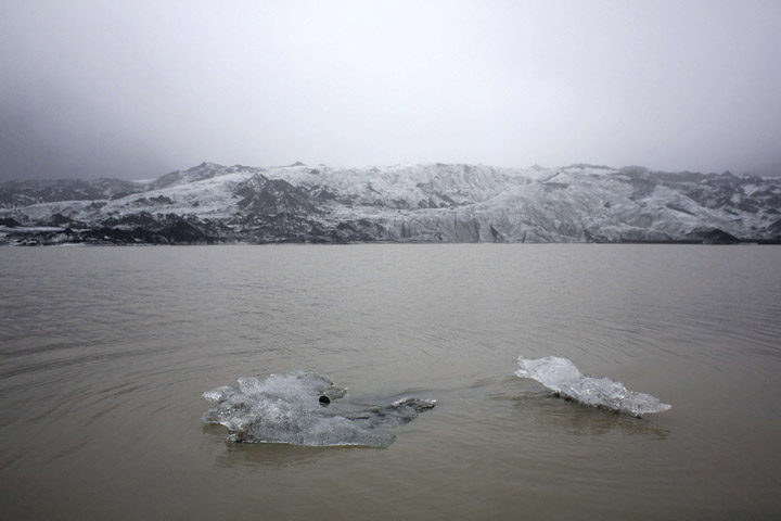 A view shows ice floating on a lake Oct. 16 in front of the Solheimajokull Glacier, where the ice has receded by more than 1 kilometer (0.6 miles) since annual measurements began in 1931. (CNS/Thibault Camus, pool via Reuters)