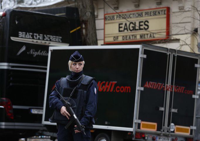 A policewoman stands guard outside the Bataclan music hall in Paris Nov. 16. The Islamic State claimed responsibility for the Nov. 13 attack on the hall. (CNS/Paul Haring) 