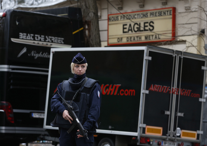 A policewoman stands guard outside the Bataclan music hall in Paris Nov. 16. The Islamic State claimed responsibility for the Nov. 13 attack on the hall. (CNS/Paul Haring)