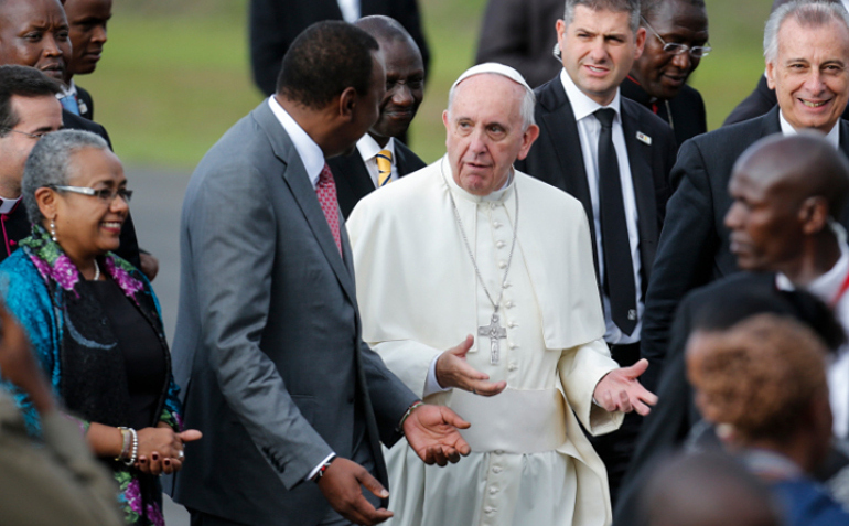 Pope Francis gestures as he chats with Kenyan President Uhuru Kenyatta after landing at Jomo Kenyatta International Airport in Nairobi, Kenya, Nov. 25. (CNS/EPA/Dai Kurokawa)