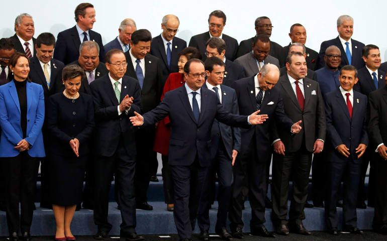 French President Francois Hollande gestures as he poses for a photo with fellow world leaders during the opening day of the U.N. climate change conference, known as the COP21 summit, in Le Bourget, France, Nov. 30. (CNS photo/Jacky Naegelen, Reuters)