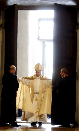 Pope Francis opens the Holy Door to inaugurate the Jubilee Year of Mercy in St. Peter's Basilica at the Vatican Dec. 8. (CNS photo/Alessandro Bianchi, Reuters)